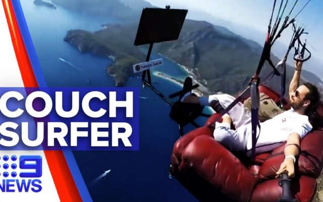 WATCH: This Guy Paraglides On His Couch Eating Chips And Watching Cartoons